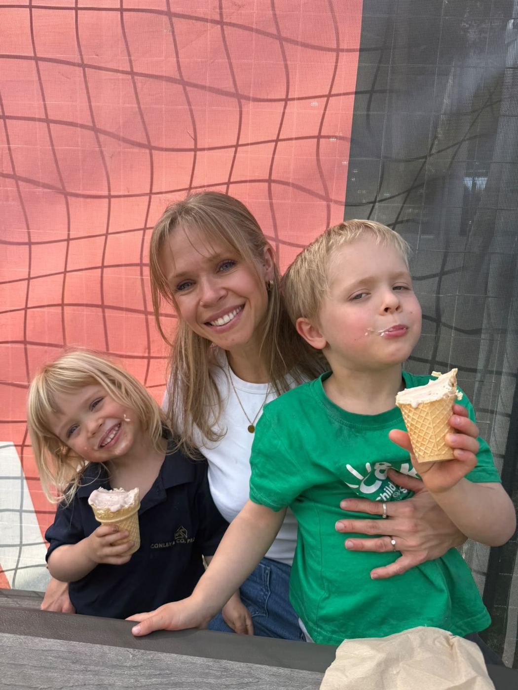 Sally sharing ice creams with her two boys